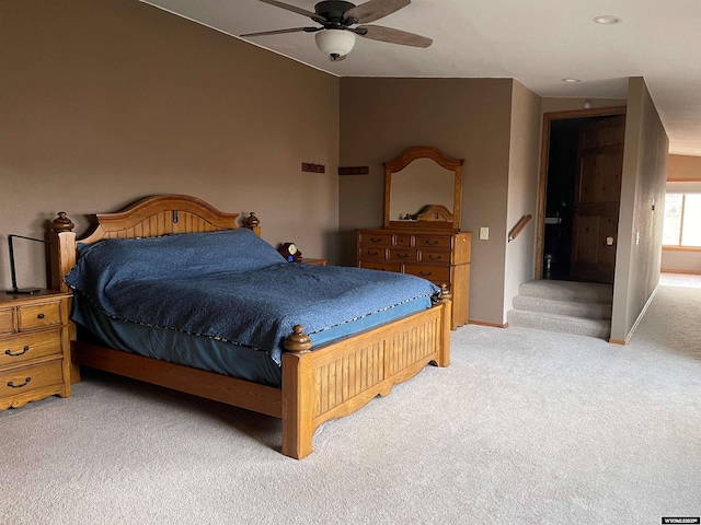 carpeted bedroom featuring ceiling fan