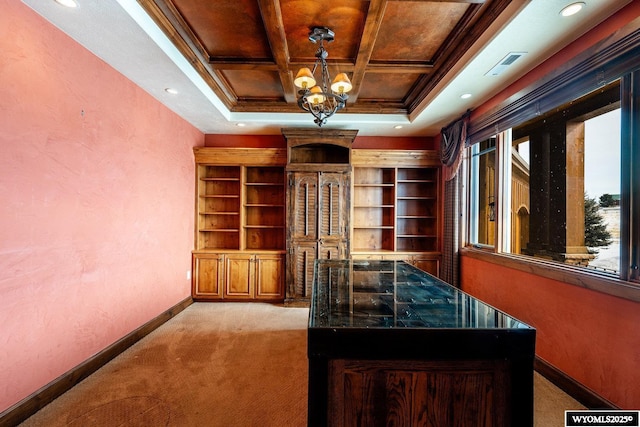 bar with hanging light fixtures, a notable chandelier, ornamental molding, coffered ceiling, and light carpet