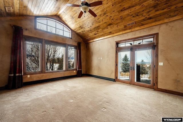 empty room with high vaulted ceiling, ceiling fan, wood ceiling, and light colored carpet