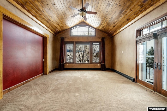 empty room with wood ceiling, french doors, light colored carpet, and lofted ceiling