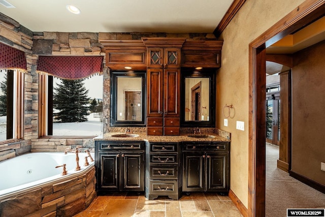 bar with sink, dark brown cabinets, and stone countertops