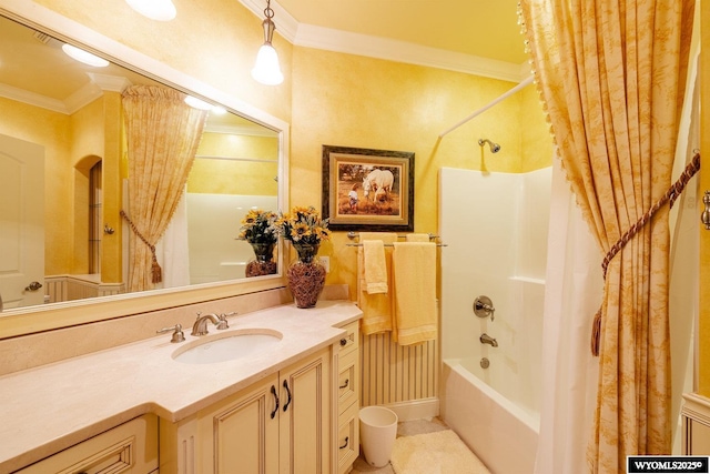 bathroom with ornamental molding, shower / bath combo with shower curtain, and vanity