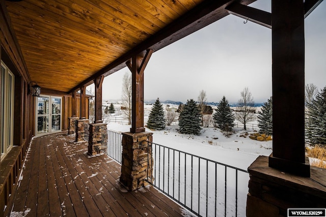 view of snow covered deck