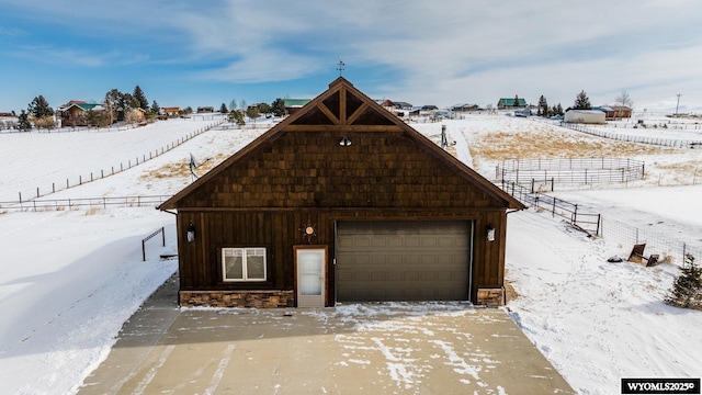 view of front of home featuring an outdoor structure and a garage