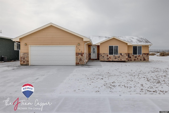 ranch-style home featuring a garage