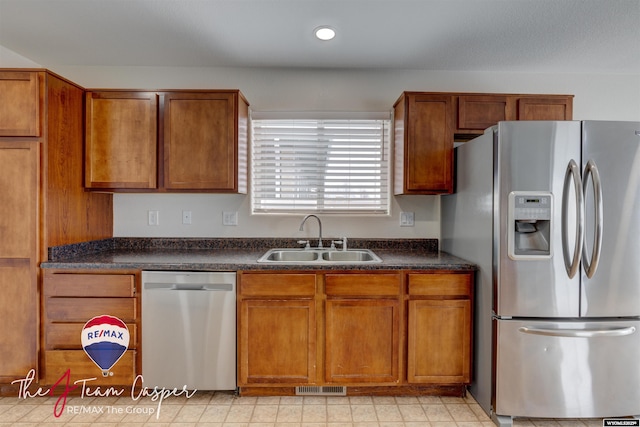 kitchen with sink and appliances with stainless steel finishes