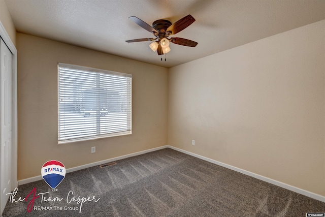 unfurnished bedroom with ceiling fan, carpet flooring, and a closet