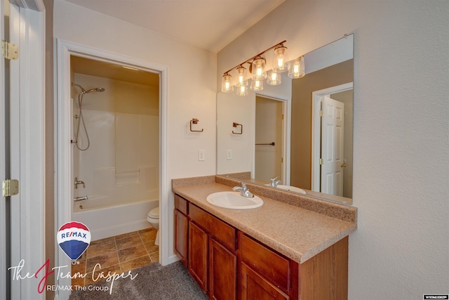 full bathroom with toilet, vanity, and washtub / shower combination