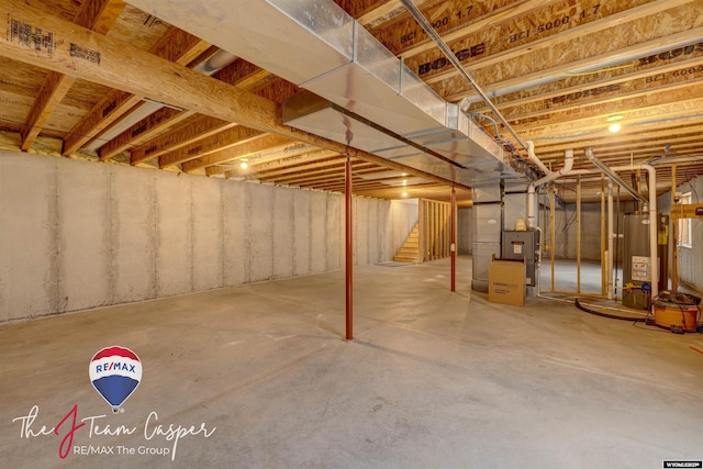 basement with heating unit and gas water heater