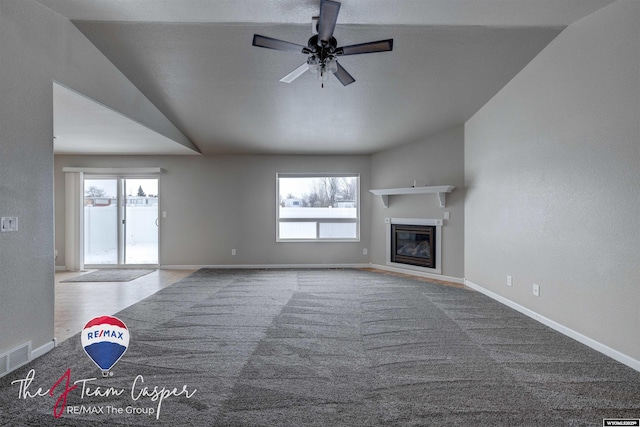 unfurnished living room featuring ceiling fan and carpet