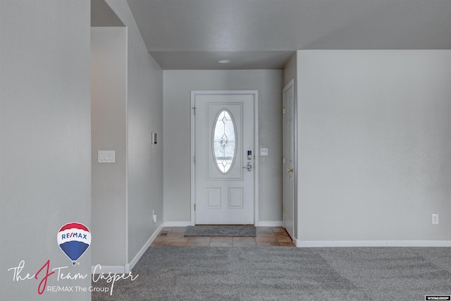 entrance foyer with light carpet