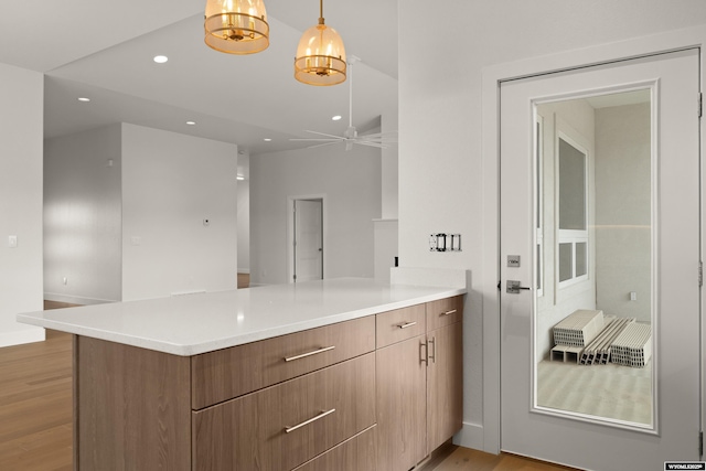 bathroom featuring a ceiling fan, baseboards, wood finished floors, and recessed lighting