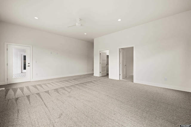 interior space with light carpet, baseboards, a ceiling fan, and recessed lighting