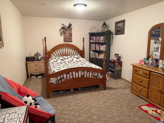 bedroom featuring light carpet