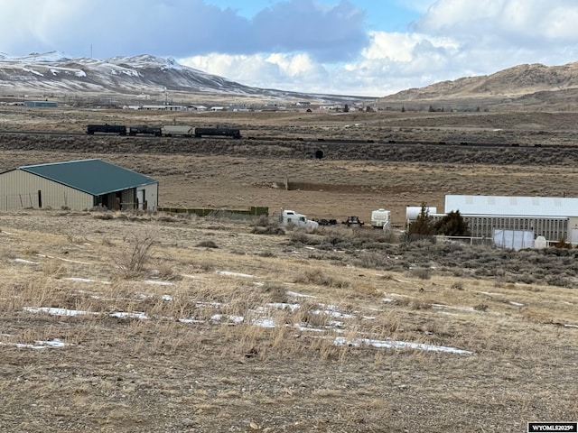 property view of mountains featuring a rural view