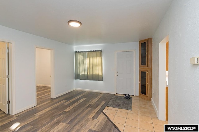 foyer entrance with hardwood / wood-style flooring