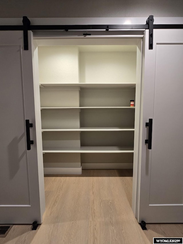 pantry with visible vents and a sauna