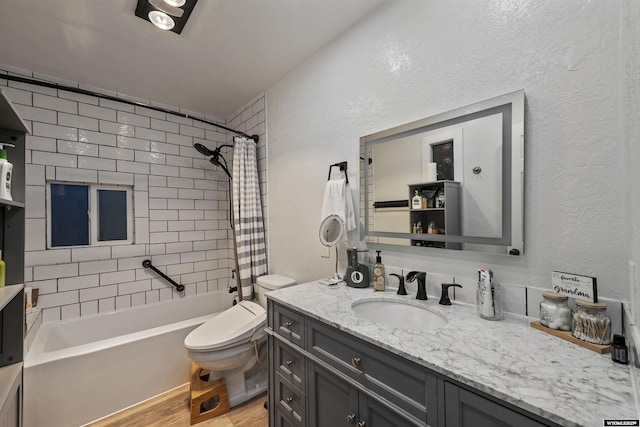 full bathroom with vanity, hardwood / wood-style floors, toilet, and shower / bath combo with shower curtain