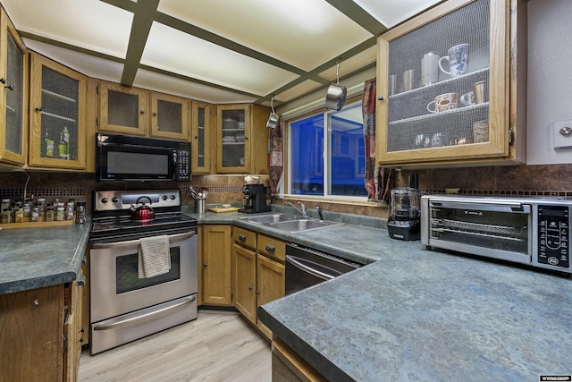 kitchen with hanging light fixtures, dishwasher, light wood-type flooring, electric range, and sink