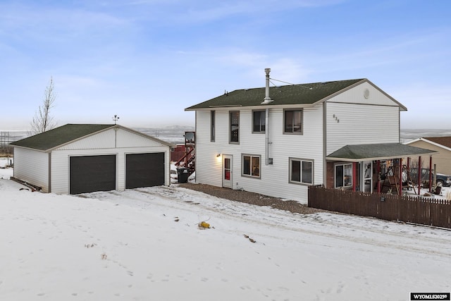 view of front of home featuring a garage and an outdoor structure