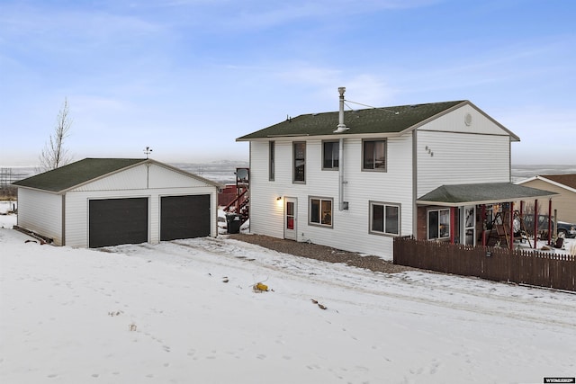 view of front of home featuring an outdoor structure and a garage