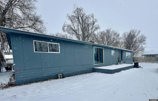 view of snow covered house