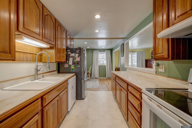 kitchen featuring sink and white appliances