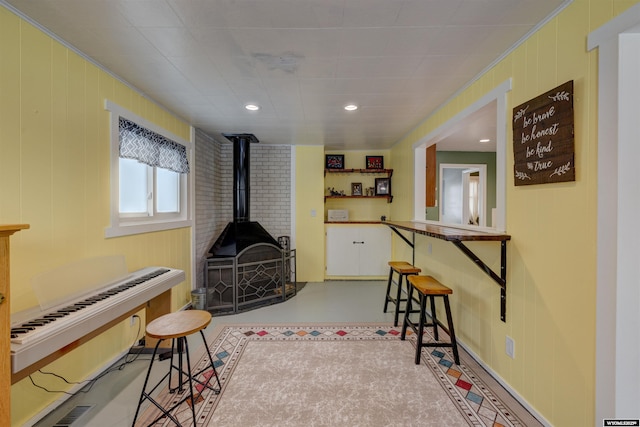 living area with a wood stove