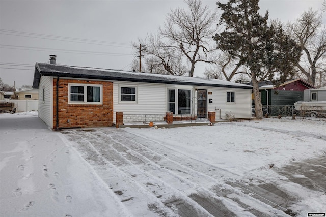 view of snow covered property