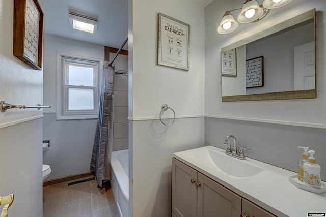 full bathroom with tile patterned flooring, toilet, vanity, and shower / bathtub combination with curtain