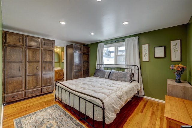 bedroom with light hardwood / wood-style floors