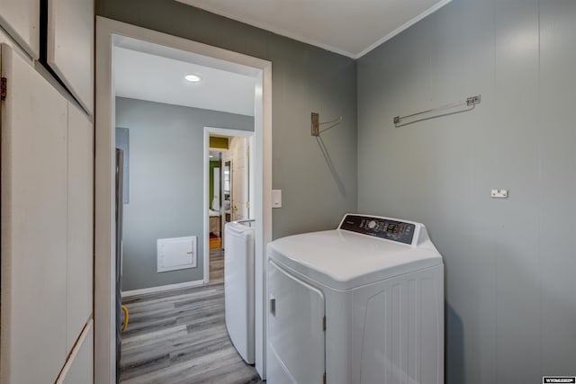 washroom featuring light wood-type flooring and separate washer and dryer