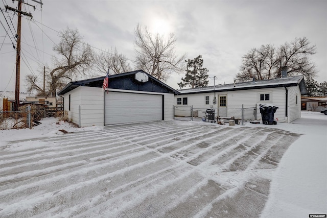 exterior space with a garage and an outdoor structure