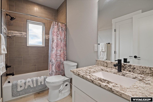 bathroom with shower / bath combination with curtain, a textured wall, vanity, and toilet