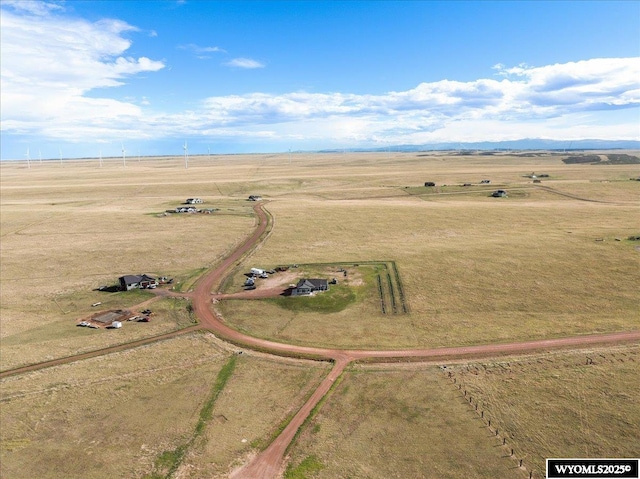 birds eye view of property with a rural view