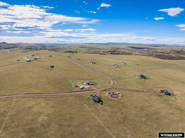 birds eye view of property with a rural view