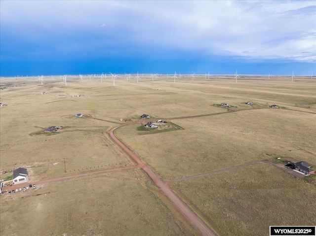 birds eye view of property with a rural view