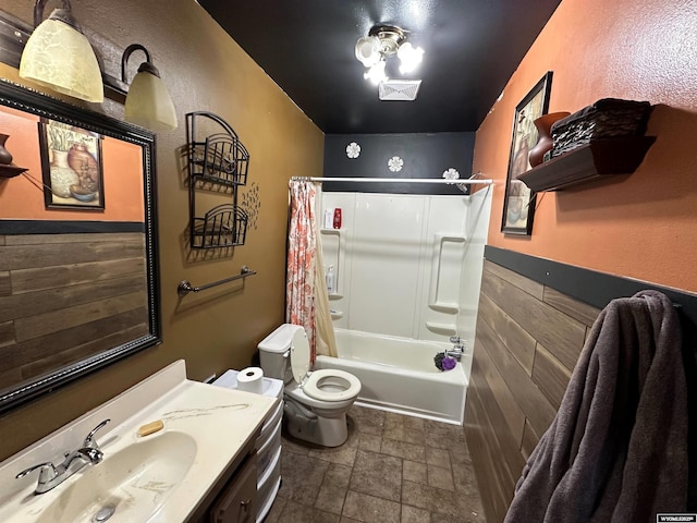 full bath with toilet, visible vents, shower / bath combination with curtain, and vanity