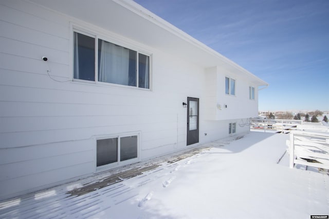 view of snow covered house