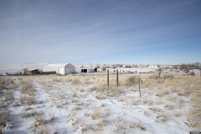 view of yard with a rural view