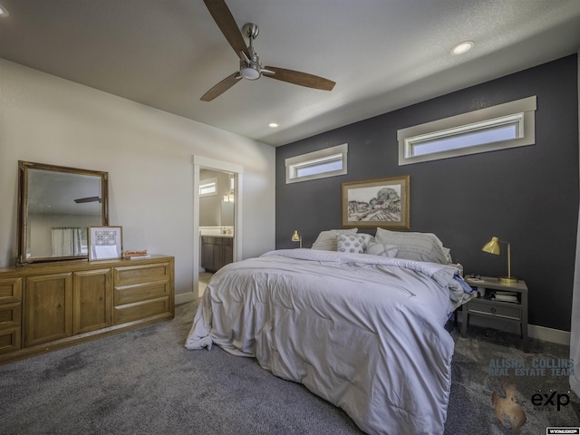 bedroom featuring ceiling fan, recessed lighting, baseboards, dark carpet, and ensuite bath