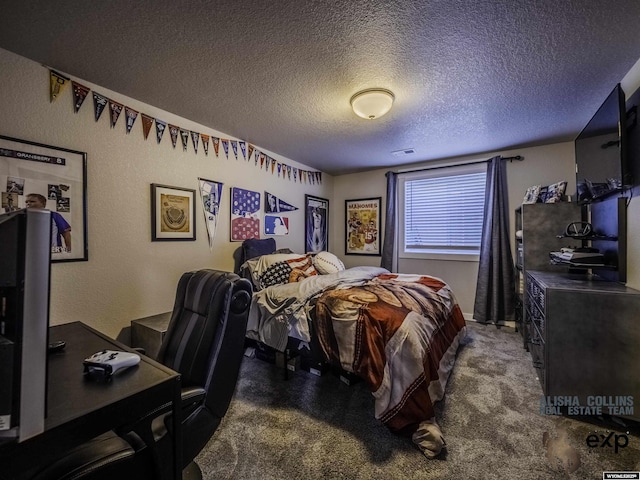 bedroom featuring dark carpet and a textured ceiling