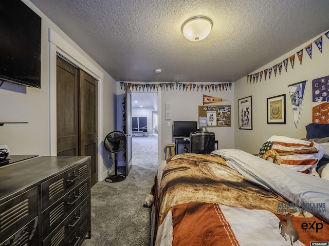 bedroom with a textured ceiling, a closet, and carpet