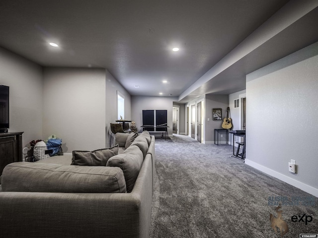 carpeted living area with baseboards and recessed lighting