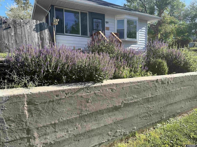 view of front of home featuring fence