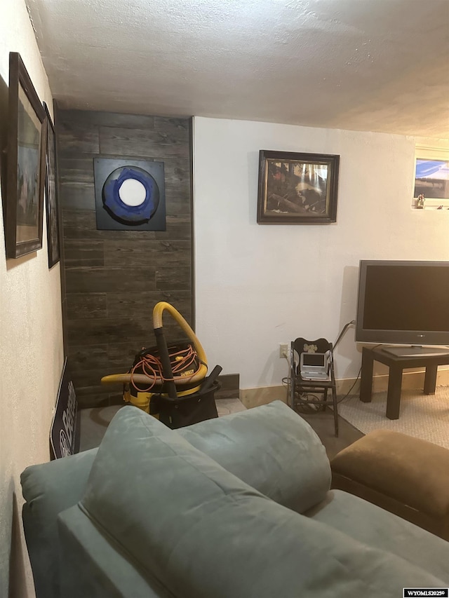 living room with carpet and a textured ceiling