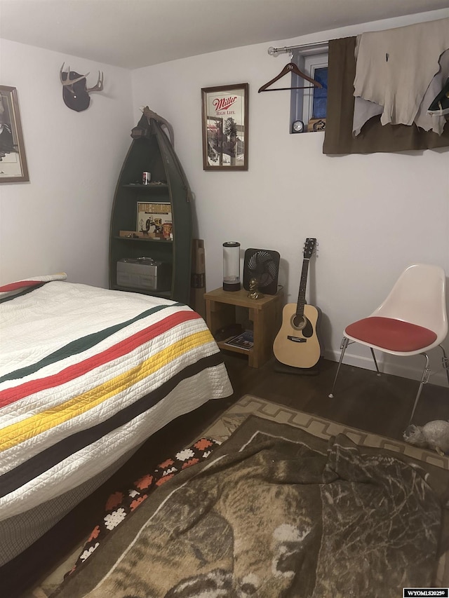 bedroom featuring wood finished floors