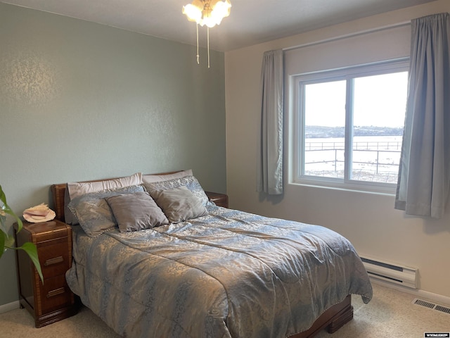 bedroom with visible vents, baseboards, a water view, carpet floors, and a baseboard heating unit