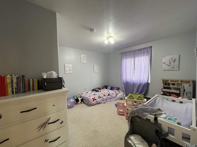 carpeted bedroom with a textured ceiling