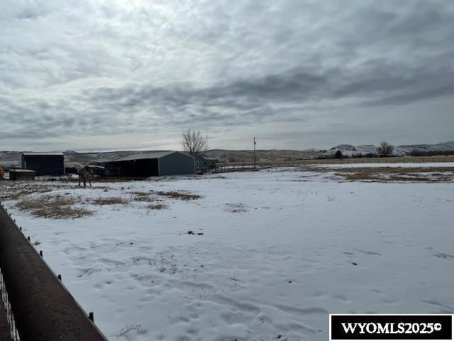 view of yard layered in snow